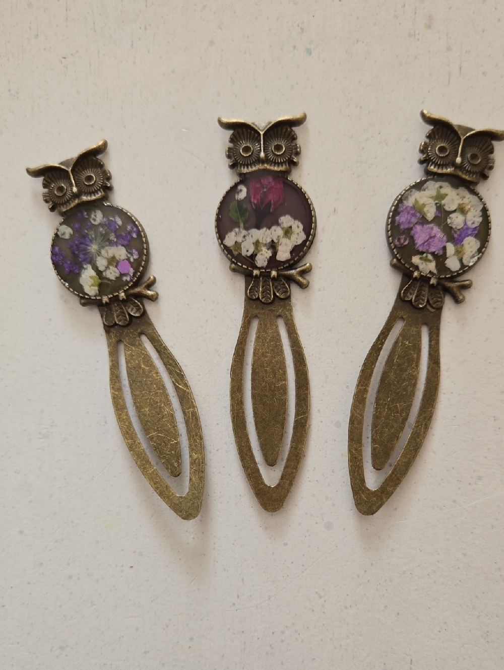 Hand Crafted Bronze Owl Bookmarks with Purple, White, and Pink Floral Accents